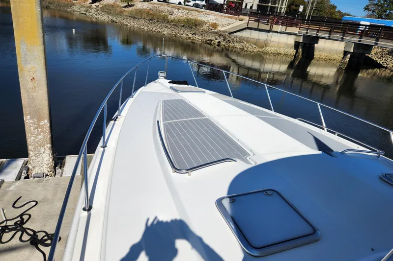H Yacht Photos Pics 2000 Formula 41 Performance Cruiser docked by a calm river, sunny day.