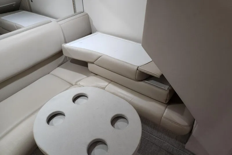 H Yacht Photos Pics Interior of 2000 Formula 41 Performance Cruiser with beige seating and table.