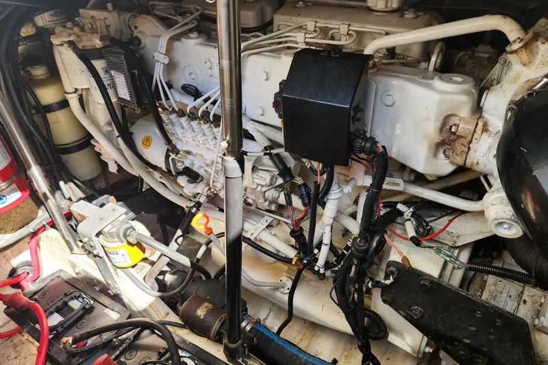 H Yacht Photos Pics Engine compartment of a 2000 Formula 41 Performance Cruiser, showcasing detailed mechanical components.