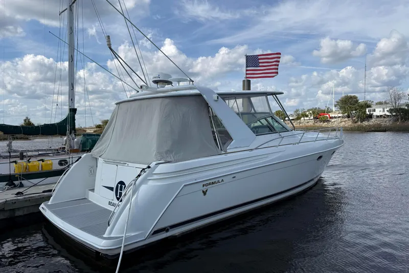 H Yacht Photos Pics 2000 Formula 41 Performance Cruiser docked, featuring sleek design and American flag.