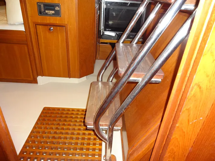 Don't Blink Yacht Photos Pics Interior of 2006 Island Packet 440 yacht with wooden steps and cabinetry.