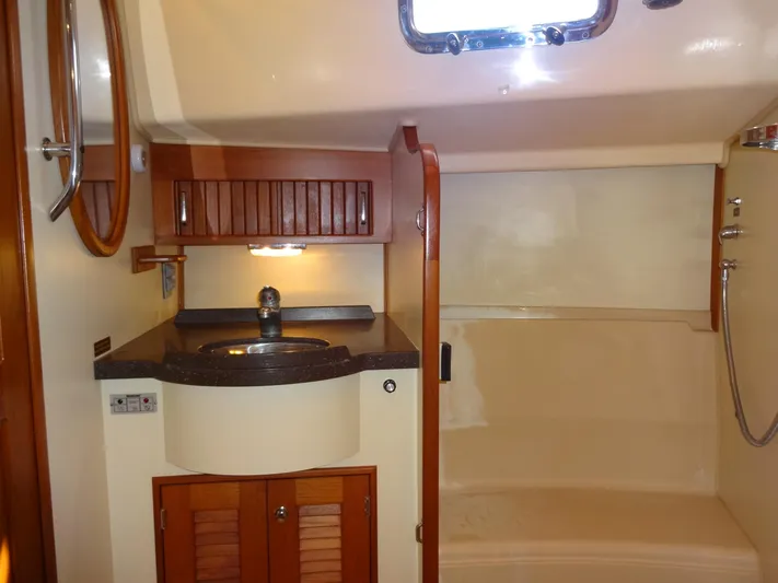 Don't Blink Yacht Photos Pics Luxurious bathroom interior of 2006 Island Packet 440 yacht with sink and shower.