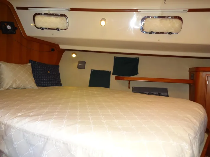 Don't Blink Yacht Photos Pics Cozy cabin interior of 2006 Island Packet 440 sailboat with comfortable bedding.