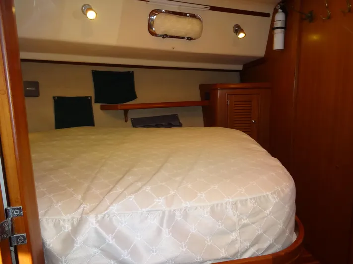 Don't Blink Yacht Photos Pics Cozy cabin interior of 2006 Island Packet 440 sailboat with wooden furnishings.