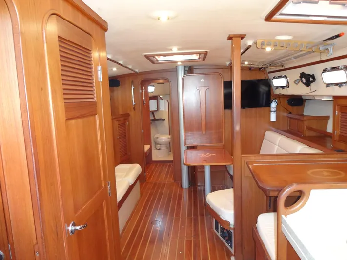 Don't Blink Yacht Photos Pics Interior of 2006 Island Packet 440 yacht with wooden finishes and seating area.