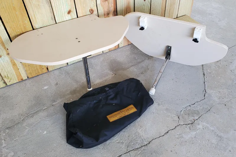 Don't Blink Yacht Photos Pics 2006 Island Packet 440 boat tables and storage bag on concrete floor.