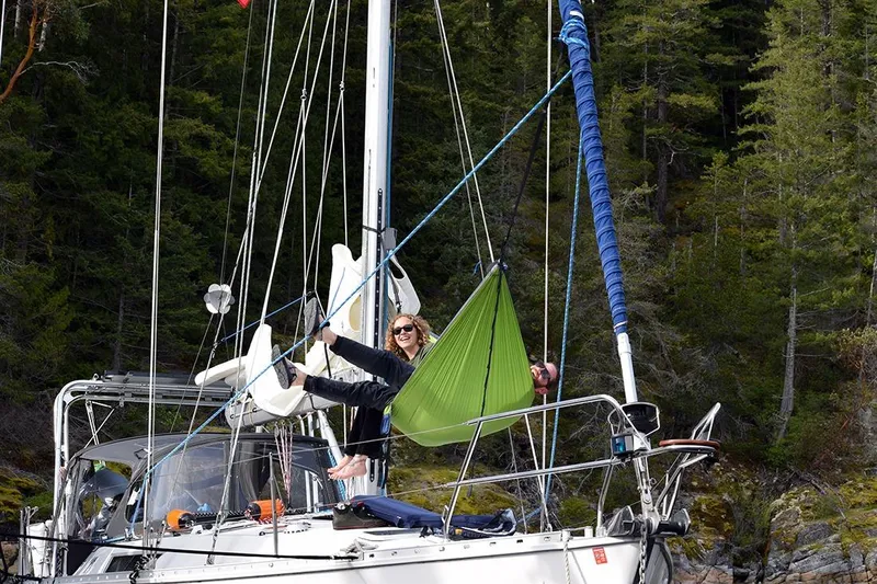 Misty Blue Yonder Yacht Photos Pics Person relaxing in a hammock on a 1995 Jeanneau Sun Odyssey 45.1 sailboat.