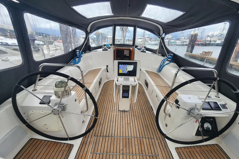 Misty Blue Yonder Yacht Photos Pics Cockpit of 1995 Jeanneau Sun Odyssey 45.1 sailboat with dual steering wheels.