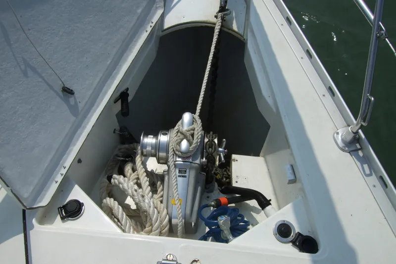 Misty Blue Yonder Yacht Photos Pics Anchor locker of 1995 Jeanneau Sun Odyssey 45.1 with ropes and winch.