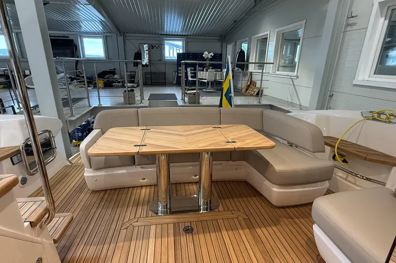 F45095 Yacht Photos Pics Luxurious 2023 Princess F45 yacht interior with elegant seating and wooden table.