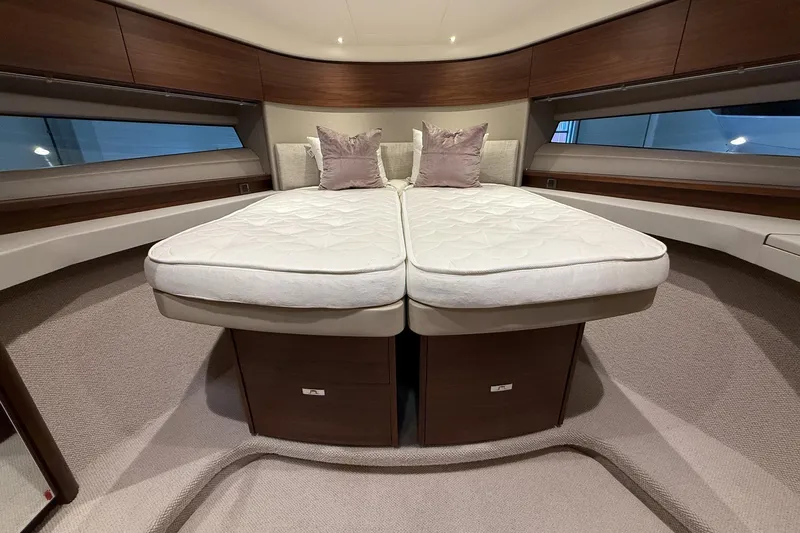 F45095 Yacht Photos Pics Luxurious 2023 Princess F45 yacht cabin with twin beds and elegant wood finish.