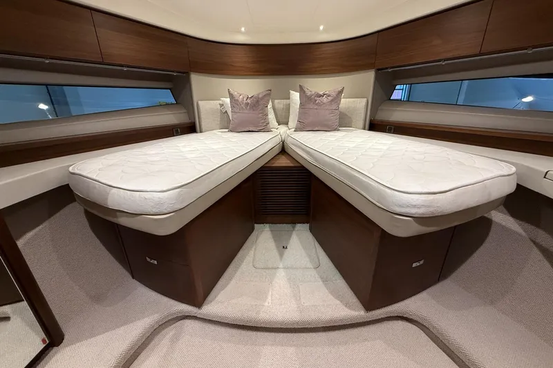 F45095 Yacht Photos Pics Luxurious 2023 Princess F45 yacht cabin with twin beds and elegant wood finish.