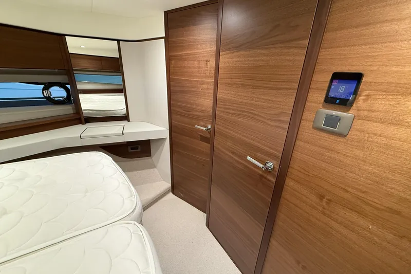 F45095 Yacht Photos Pics Luxurious cabin interior of 2023 Princess F45 yacht with wooden finishes and modern amenities.