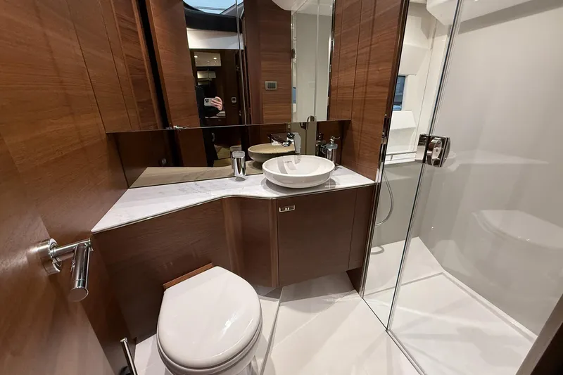 F45095 Yacht Photos Pics Luxurious bathroom in 2023 Princess F45 yacht with modern fixtures and wood accents.
