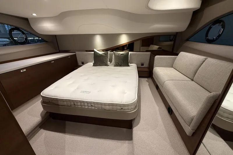 F45095 Yacht Photos Pics Luxurious interior of 2023 Princess F45 yacht with elegant bed and seating area.