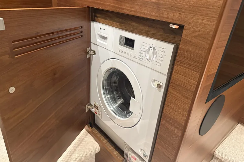 F45095 Yacht Photos Pics Built-in washing machine in 2023 Princess F45 yacht's wooden cabinet.