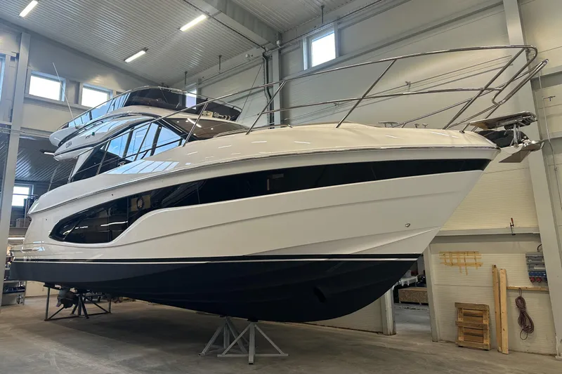 F45095 Yacht Photos Pics 2023 Princess F45 yacht in a showroom, showcasing sleek design and modern features.