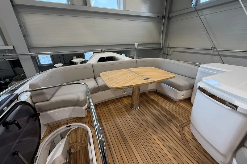 F45095 Yacht Photos Pics Luxurious 2023 Princess F45 yacht interior with elegant seating and wooden table.
