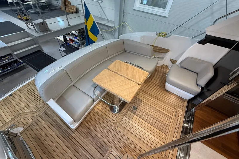 F45095 Yacht Photos Pics Luxurious 2023 Princess F45 yacht interior with elegant seating and wooden flooring.