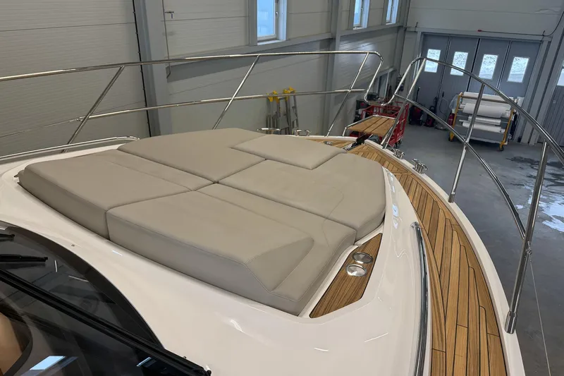 F45095 Yacht Photos Pics Luxurious 2023 Princess F45 yacht with spacious sunbathing deck in a modern indoor setting.