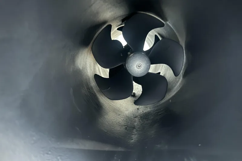 F45095 Yacht Photos Pics Close-up of a 2023 Princess F45 yacht's propeller inside a tunnel.