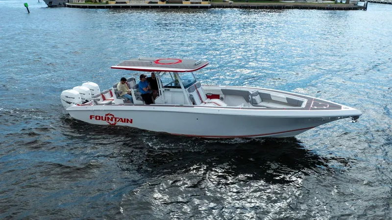Havana Club Yacht Photos Pics 2023 Fountain 38 SC boat cruising on water, featuring sleek design and powerful engines.