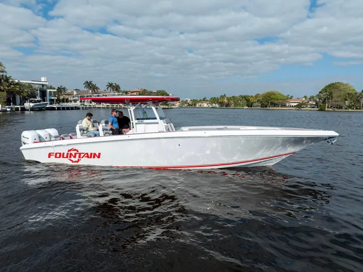 Havana Club Yacht Photos Pics 2023 Fountain 38 SC boat cruising on a sunny day, featuring sleek design and powerful engines.