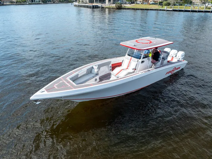 Havana Club Yacht Photos Pics 2023 Fountain 38 SC boat on calm water, featuring sleek design and modern amenities.