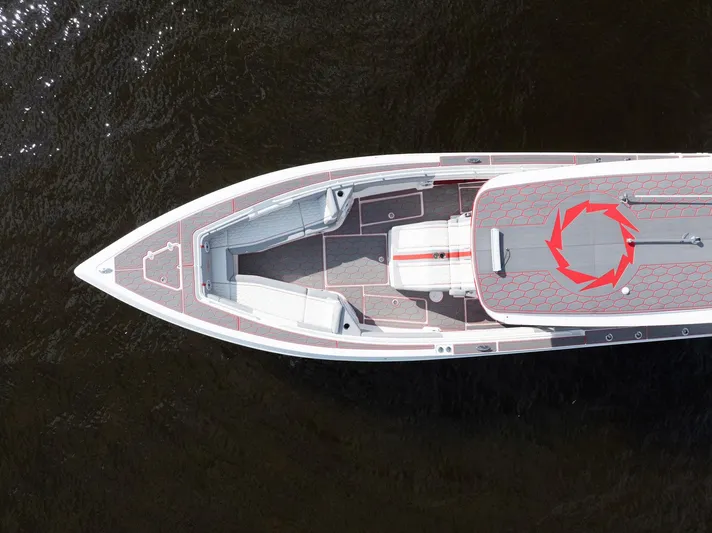 Havana Club Yacht Photos Pics Aerial view of 2023 Fountain 38 SC boat on dark water.