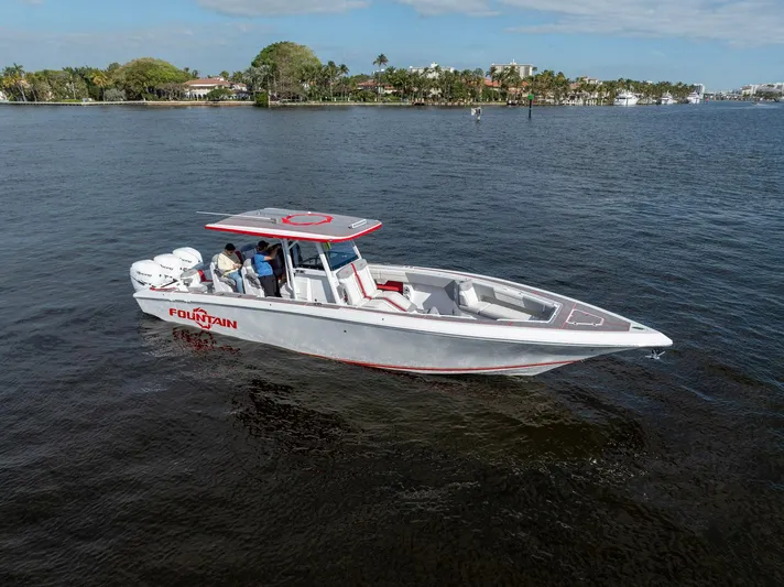 Havana Club Yacht Photos Pics 2023 Fountain 38 SC boat on calm water, featuring sleek design and modern amenities.