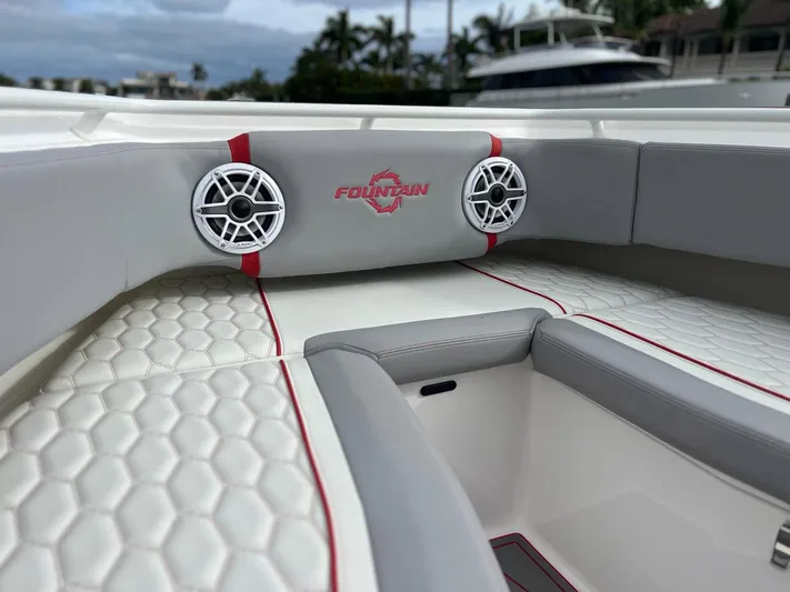 Havana Club Yacht Photos Pics 2023 Fountain 38 SC boat interior with stylish seating and speakers.