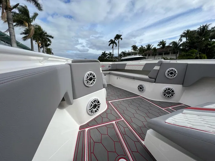 Havana Club Yacht Photos Pics 2023 Fountain 38 SC boat interior with gray seating and modern speaker system.