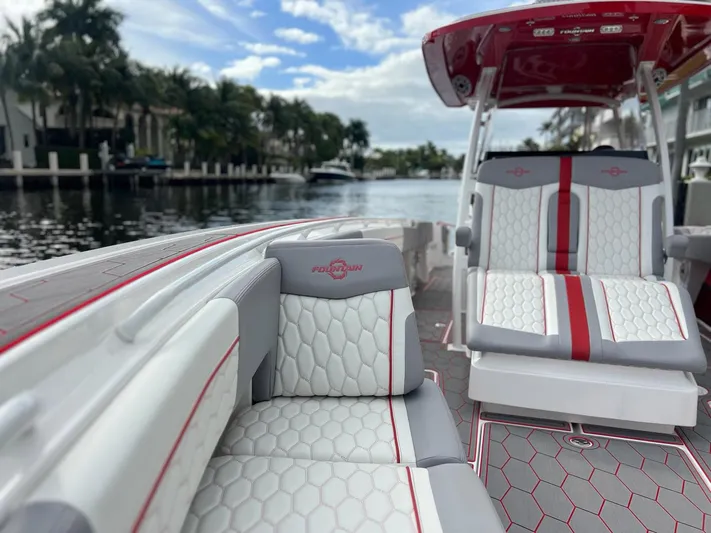 Havana Club Yacht Photos Pics 2023 Fountain 38 SC boat interior with stylish seating and waterfront view.