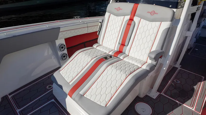 Havana Club Yacht Photos Pics 2023 Fountain 38 SC boat seats with red accents and hexagonal pattern.