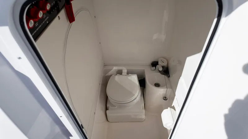 Havana Club Yacht Photos Pics 2023 Fountain 38 SC boat interior bathroom with toilet and sink.