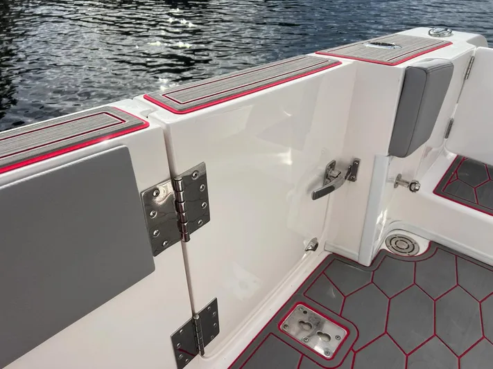 Havana Club Yacht Photos Pics 2023 Fountain 38 SC boat interior with gray and red accents, featuring stainless steel hardware.