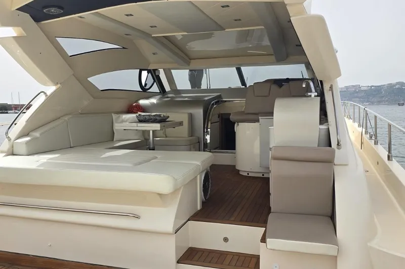  Yacht Photos Pics Luxurious 2003 Cayman Yachts 55-58 Walkaround HT interior with elegant seating and helm.