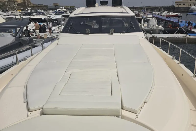  Yacht Photos Pics 2003 Cayman Yachts 55-58 Walkaround HT, docked with spacious sunbathing area.