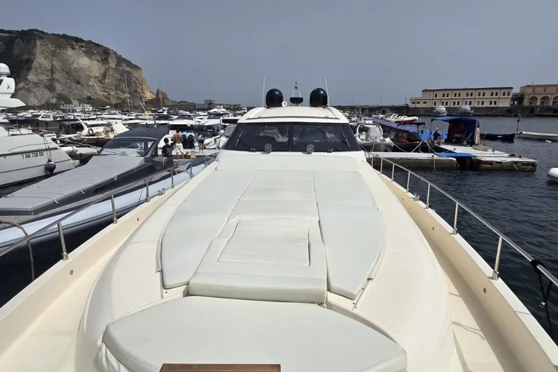  Yacht Photos Pics Luxury Cayman Yachts 55-58 Walkaround HT, 2003 model, docked in a scenic marina.