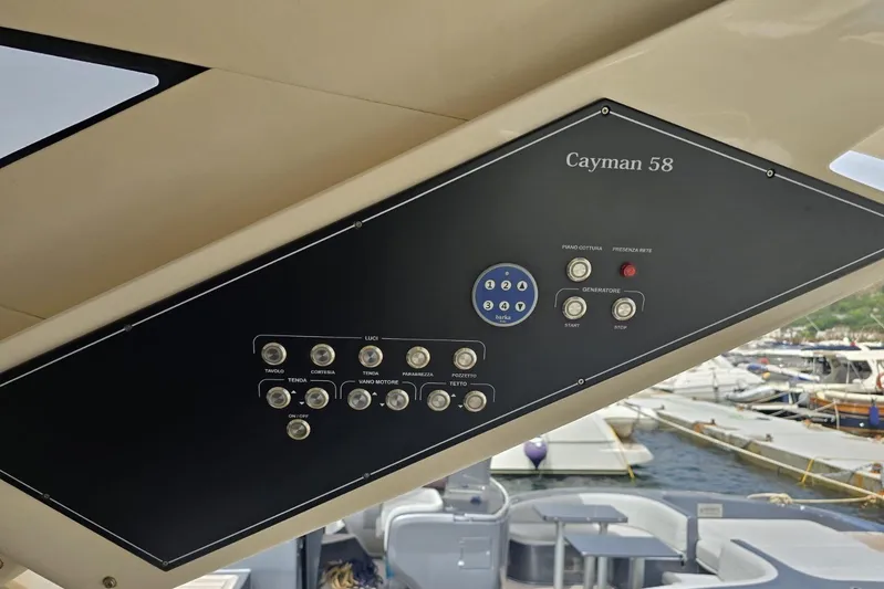  Yacht Photos Pics Control panel of 2003 Cayman Yachts 55-58 Walkaround HT, docked at marina.