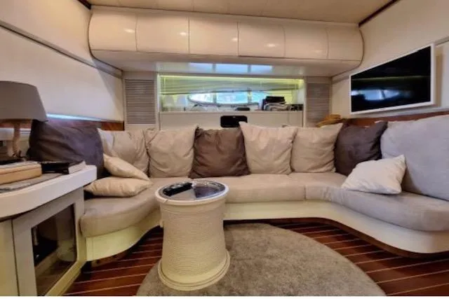  Yacht Photos Pics Luxurious interior of 2003 Cayman Yachts 55-58 Walkaround HT with plush seating and modern decor.