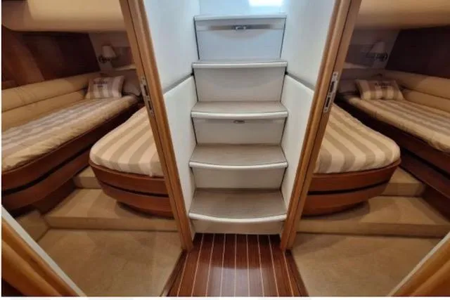  Yacht Photos Pics Luxurious interior of 2003 Cayman Yachts 55-58 Walkaround HT with twin beds and elegant design.