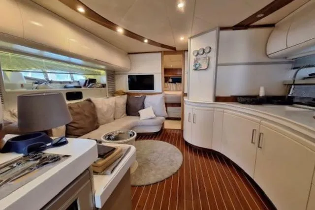  Yacht Photos Pics Luxurious interior of 2003 Cayman Yachts 55-58 Walkaround HT with modern furnishings.