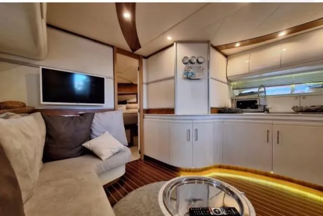  Yacht Photos Pics Luxurious interior of 2003 Cayman Yachts 55-58 Walkaround HT with modern amenities.