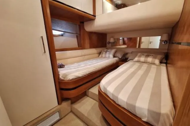 Yacht Photos Pics Luxurious cabin interior of 2003 Cayman Yachts 55-58 Walkaround HT with twin beds.