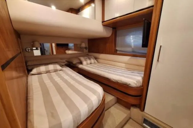  Yacht Photos Pics Luxurious cabin interior of 2003 Cayman Yachts 55-58 Walkaround HT with twin beds.