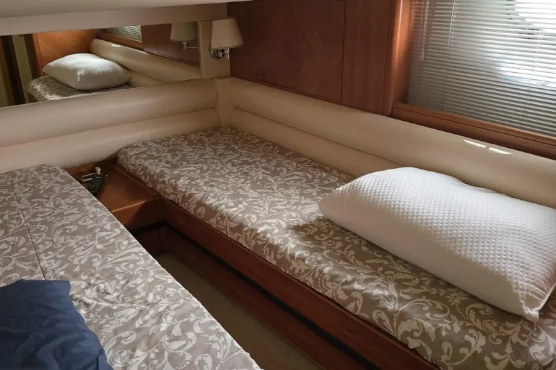  Yacht Photos Pics Luxurious cabin interior of 2003 Cayman Yachts 55-58 Walkaround HT with elegant bedding.