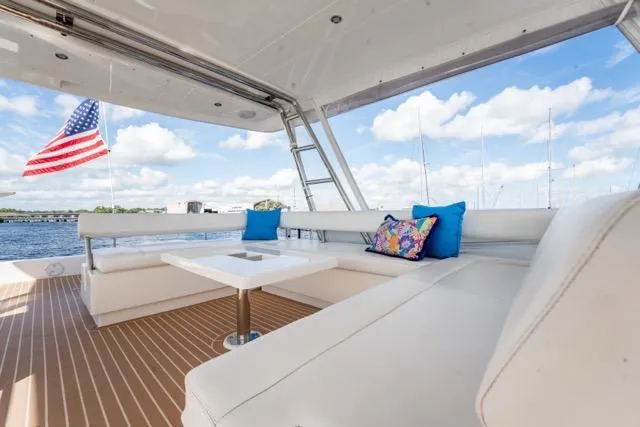 Catfish Yacht Photos Pics Luxurious 2017 Leopard 51 Powercat yacht with spacious seating, American flag, and scenic water view.