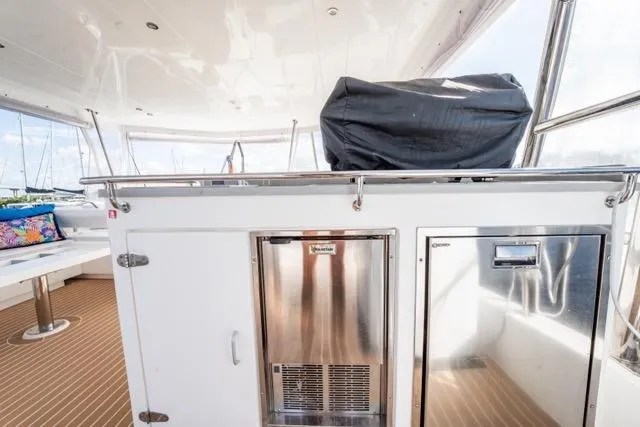 Catfish Yacht Photos Pics Outdoor kitchen area on a 2017 Leopard 51 Powercat yacht with stainless steel appliances.