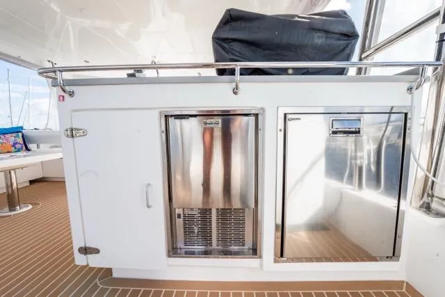 Catfish Yacht Photos Pics Outdoor kitchen area on a 2017 Leopard 51 Powercat yacht with stainless steel appliances.